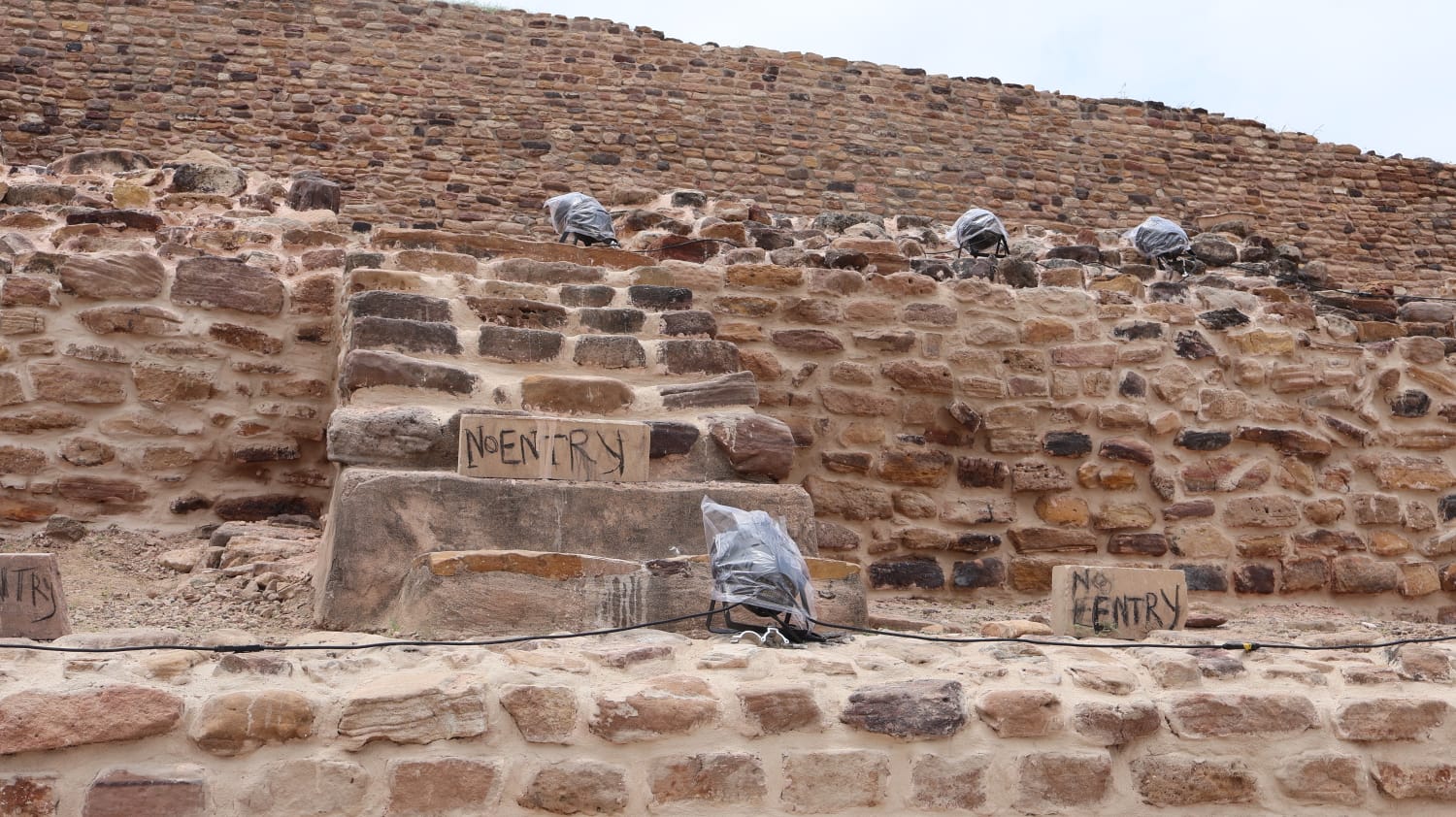 Stone steps and excavated masonry at a Harappan archaeological site
