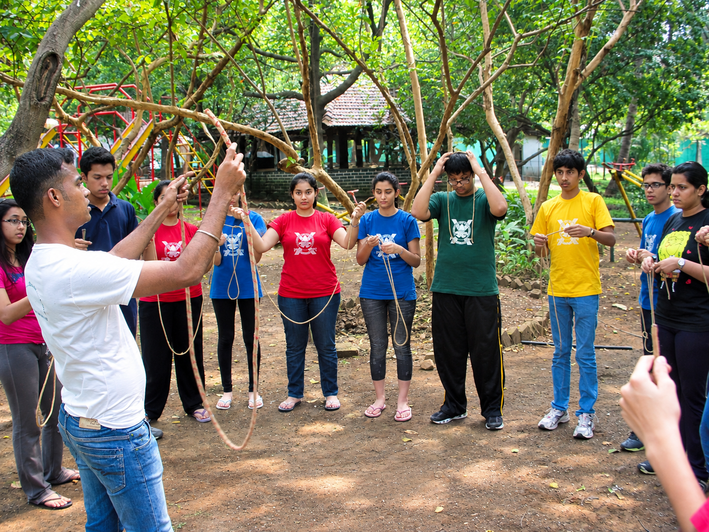 An instructor facilitating a rope-skills session on campus