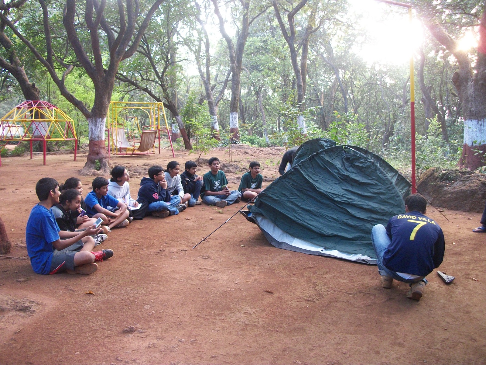 Younger students pitching tents at camp