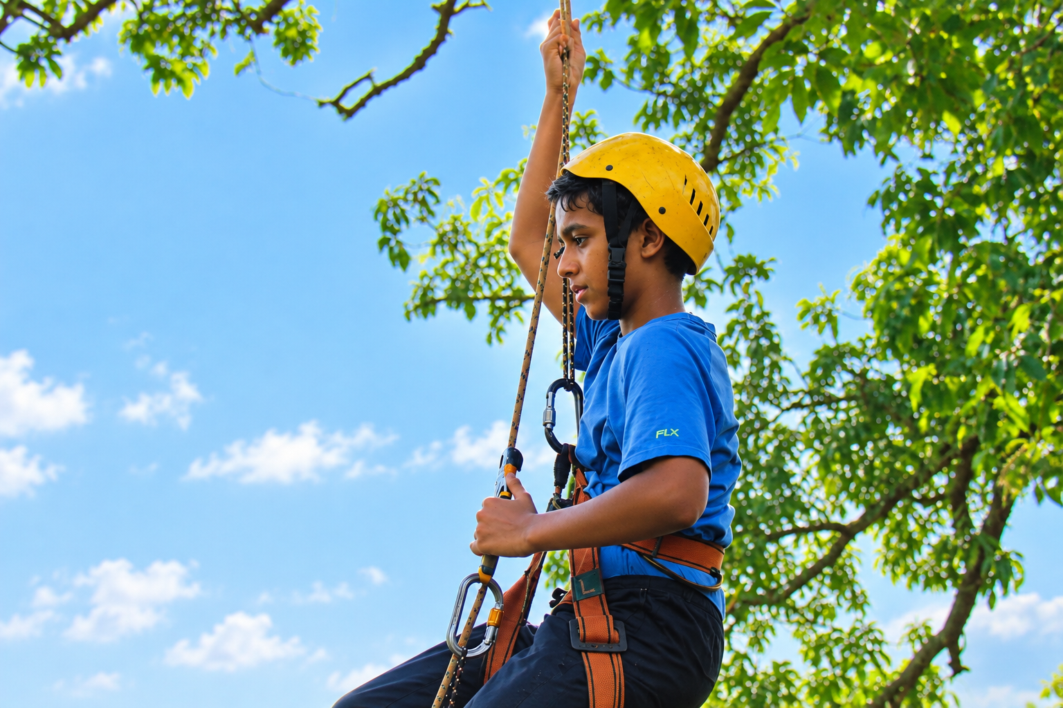 A student on a ropes course during an outbound module
